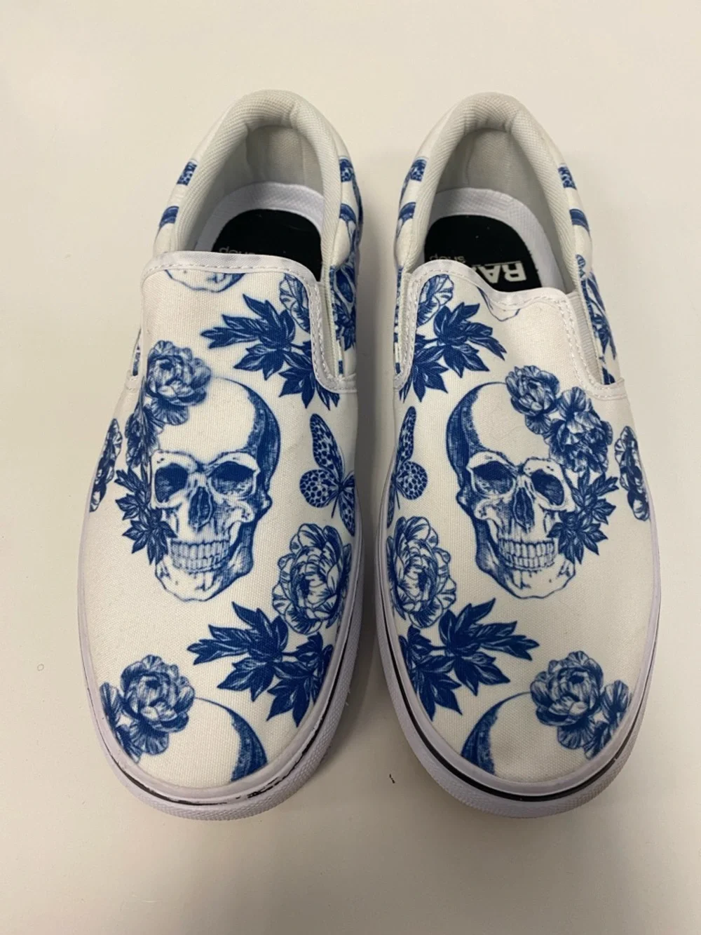 White Slip-On Women’s Sneakers with Blue Skull & Floral Print - Picture 1 of 5